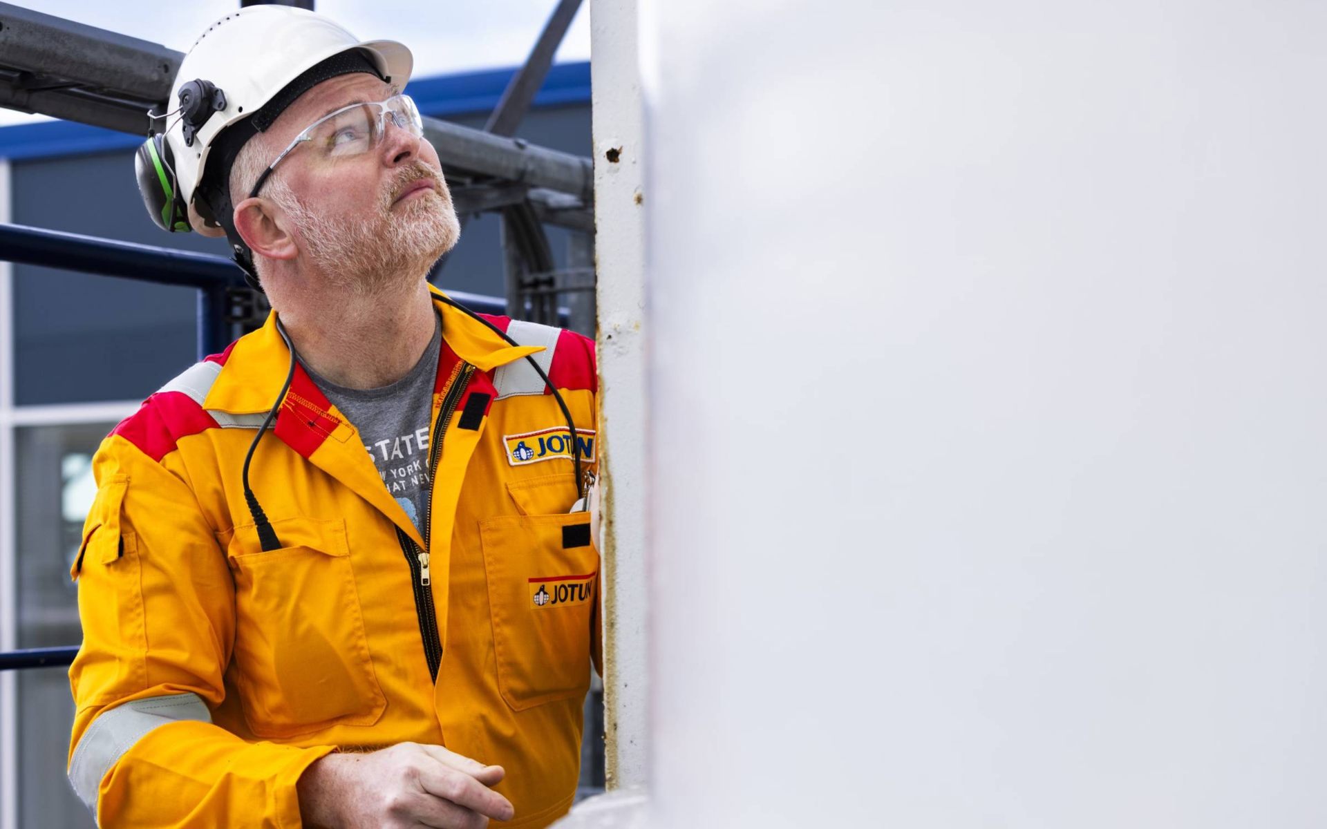 VeldCoat technical inspector at an industrial coated surface